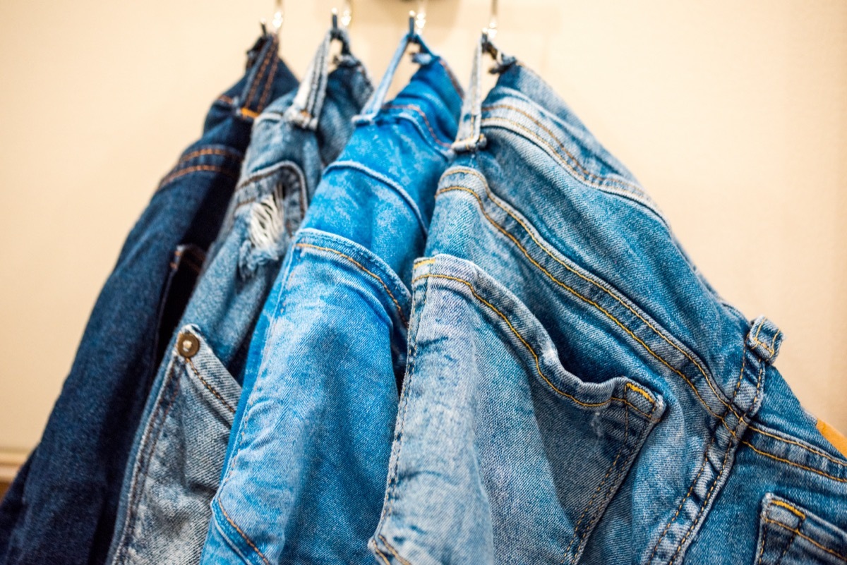 jeans hanging on a rack