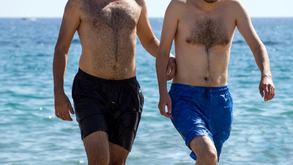 men on the beach in swim trunks, make yourself more attractive 