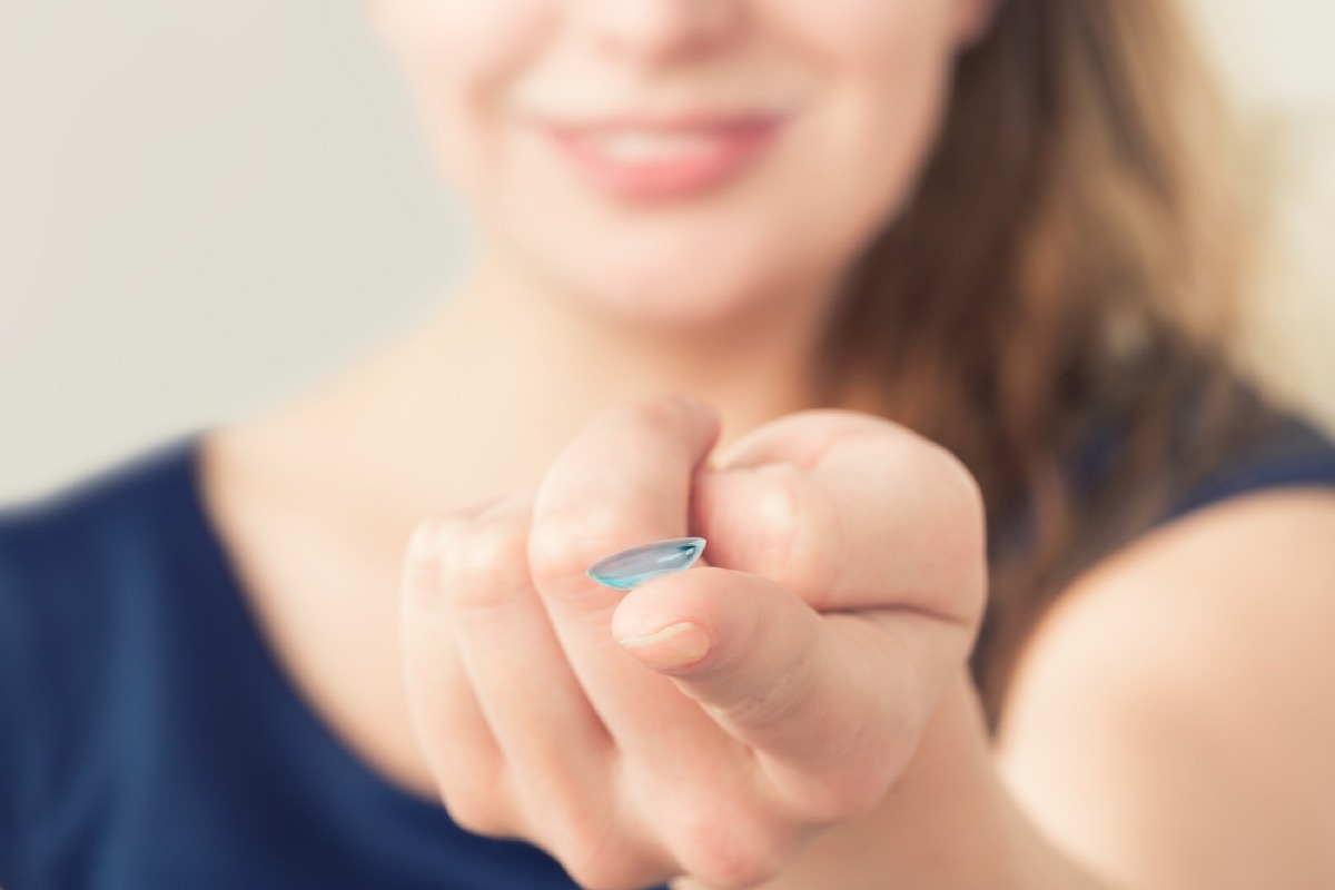 woman holding colored contact, look better after 40