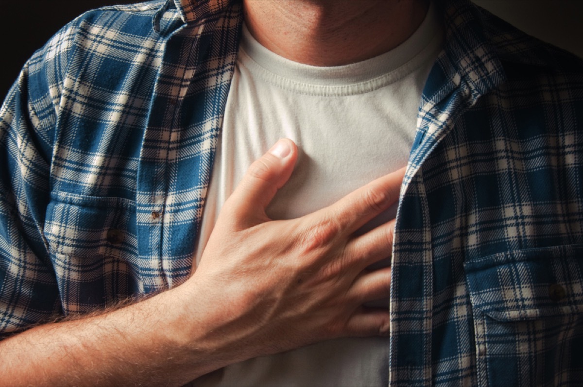 close up of white man's hand on chest