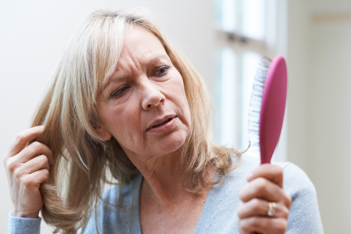 Woman Looking at Her Brush