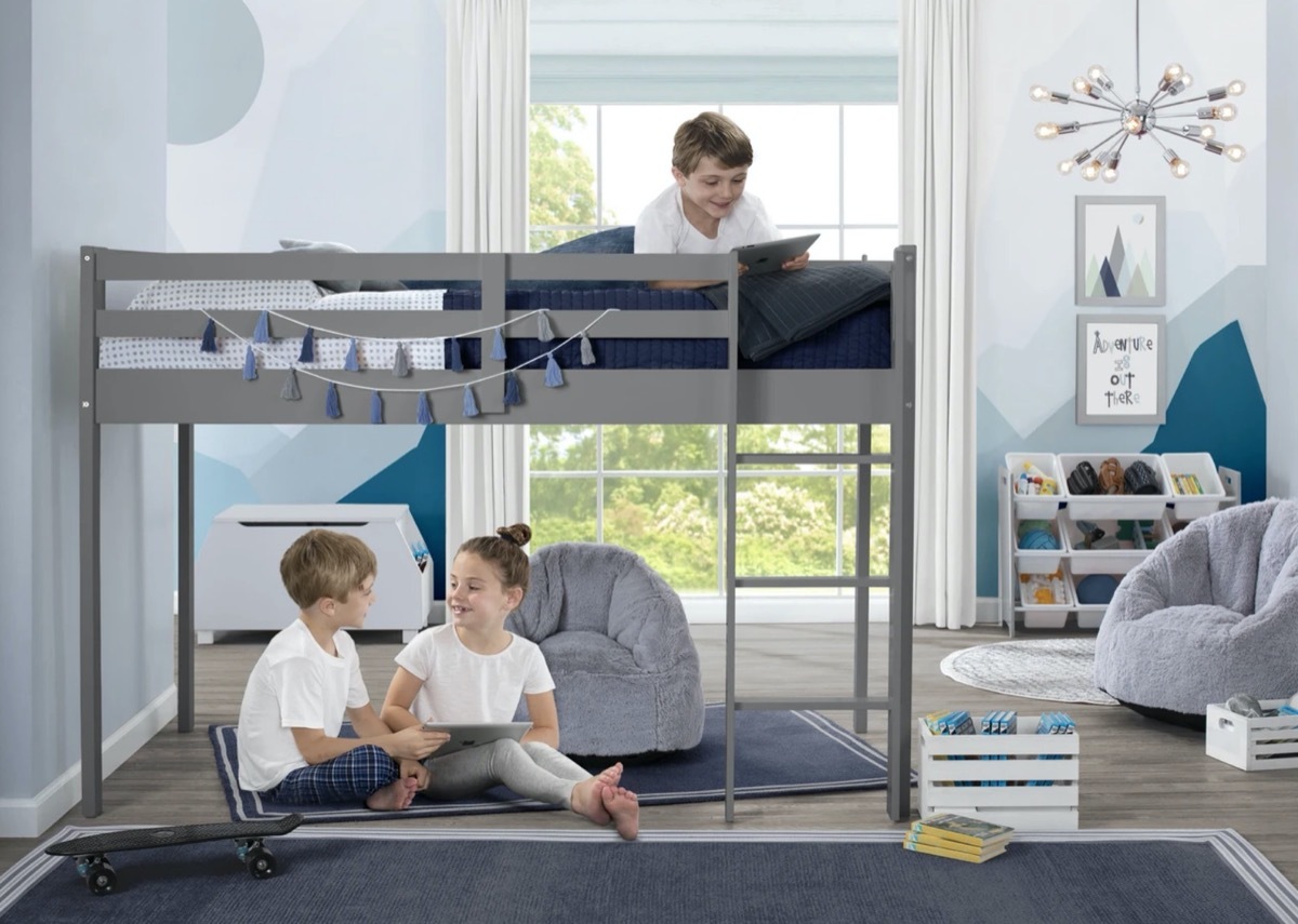 children playing on and under gray loft bed