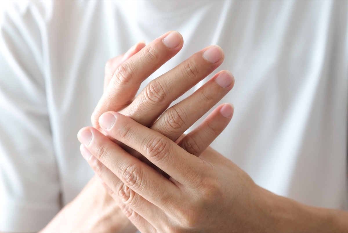 Closeup of woman's hands pain discomfort