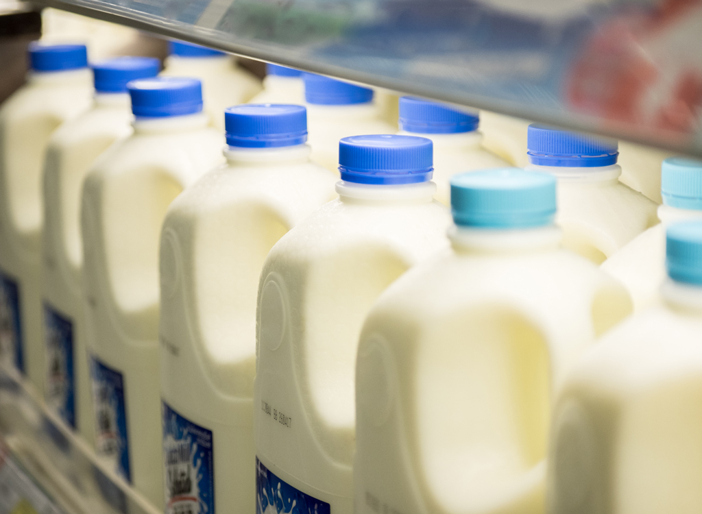 milk jugs on shelf