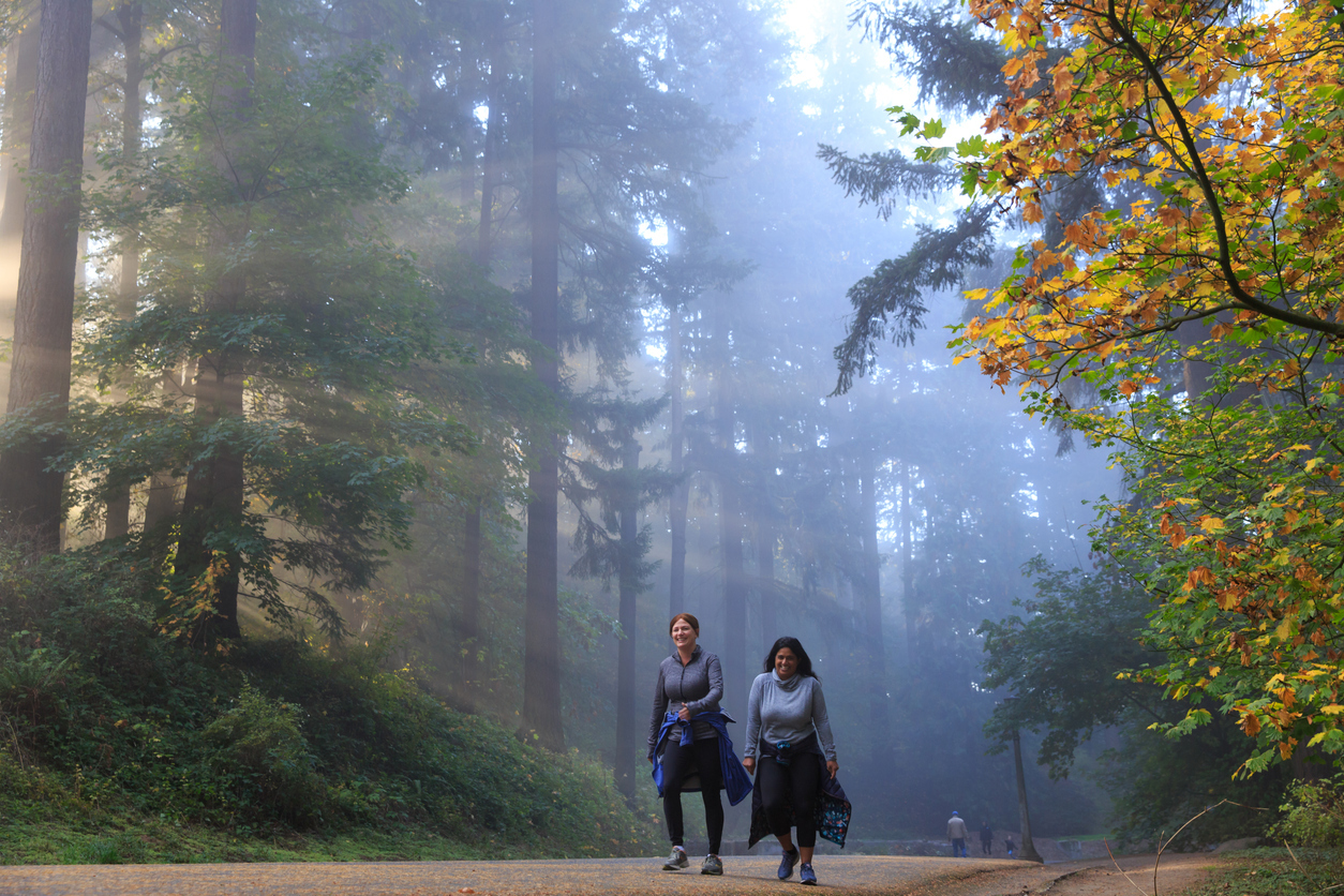 two women walking mount tabor in portland