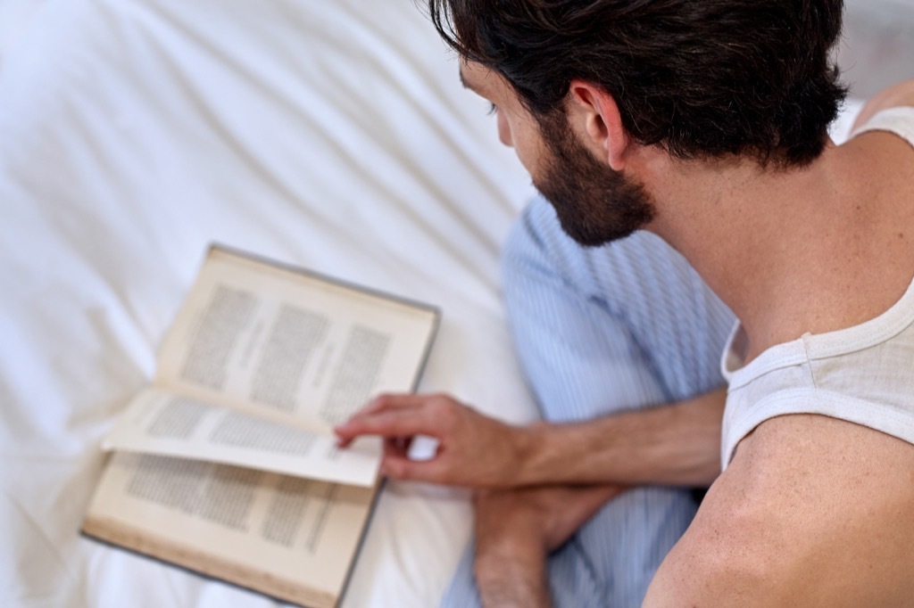 Man Reading in Bed {Stay Sane During the Holidays}