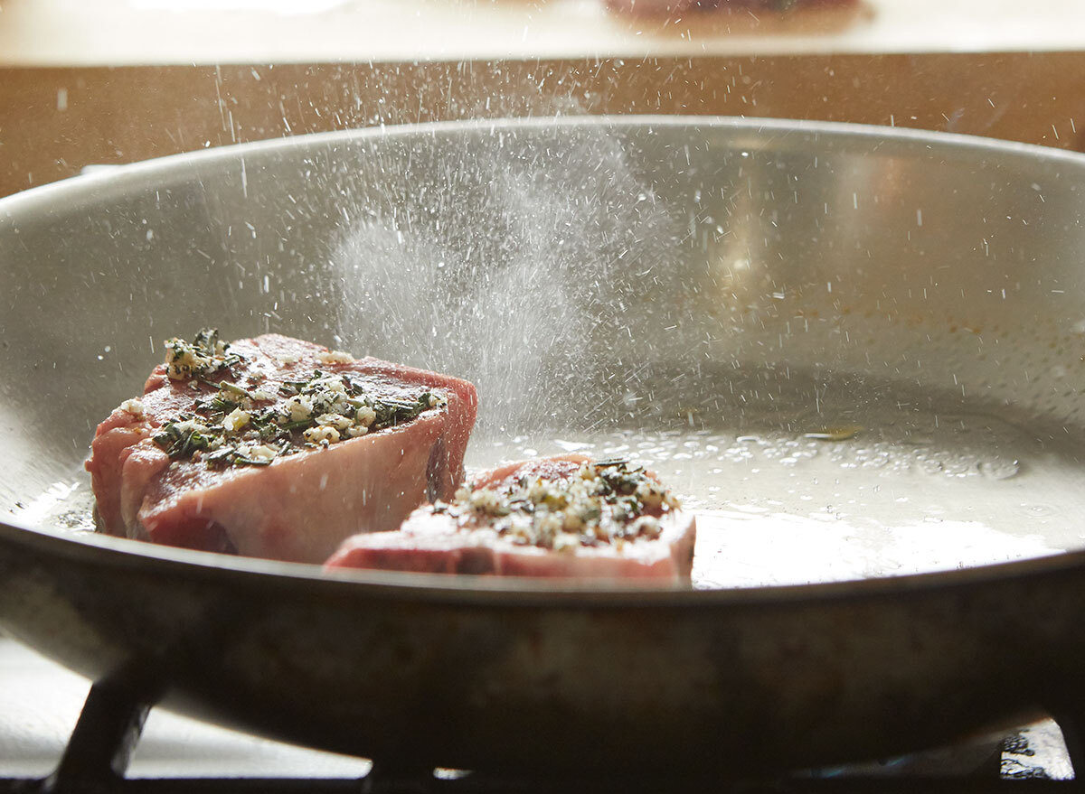 Cooking lamb chops in a skillet