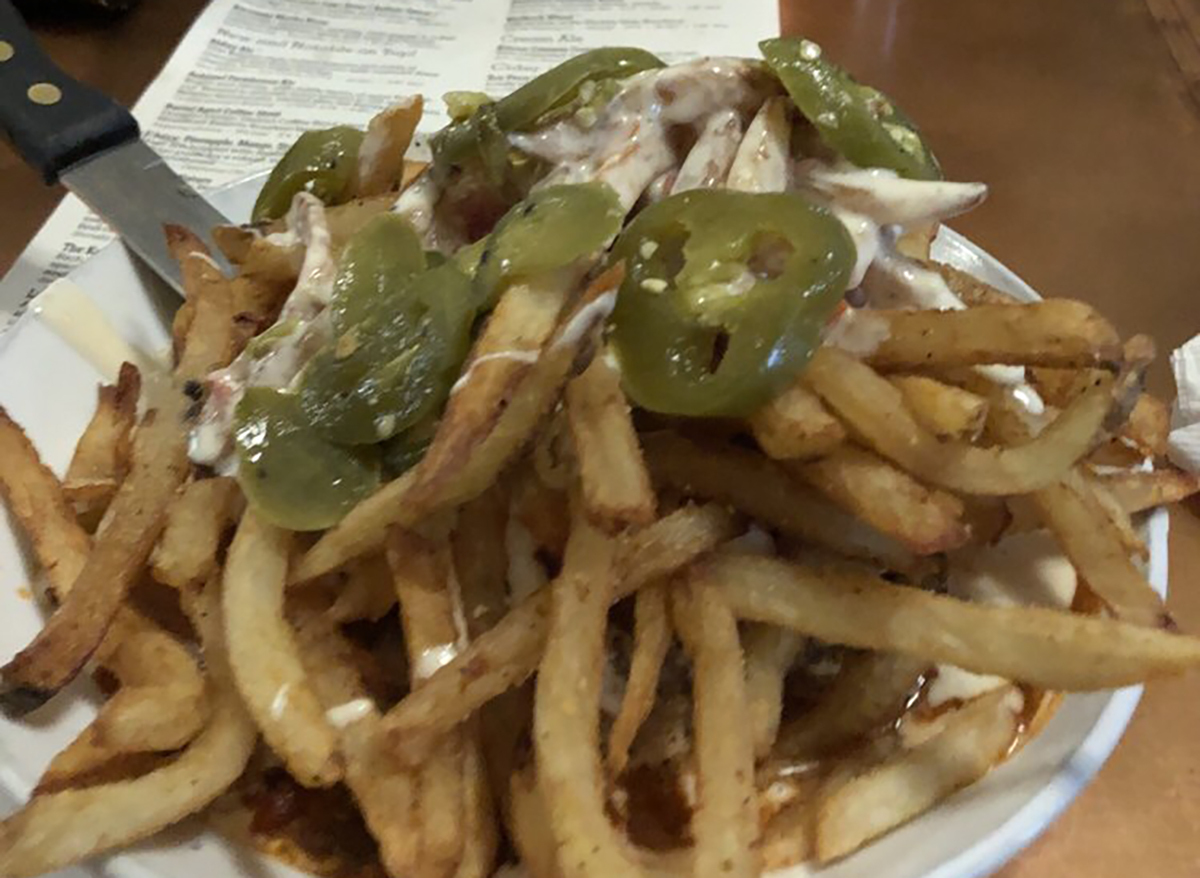 fries topped with sliced jalapenos