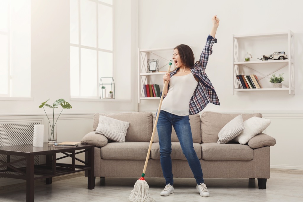 woman dancing and mopping