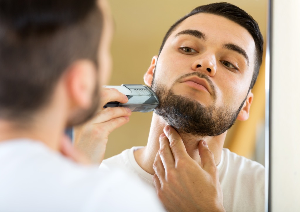 a man shaving his beard