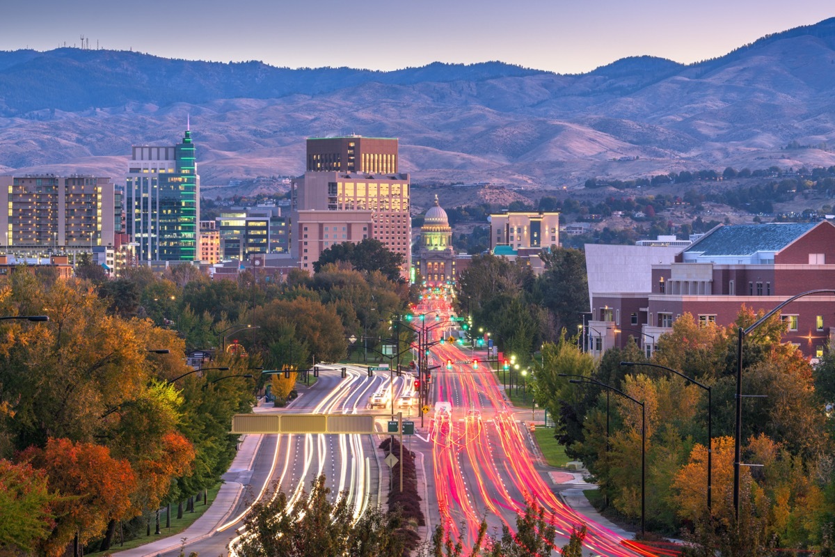 cityscape photos of mountains, moving cars, buildings, and the state capitol in Boise, Idaho at sunset