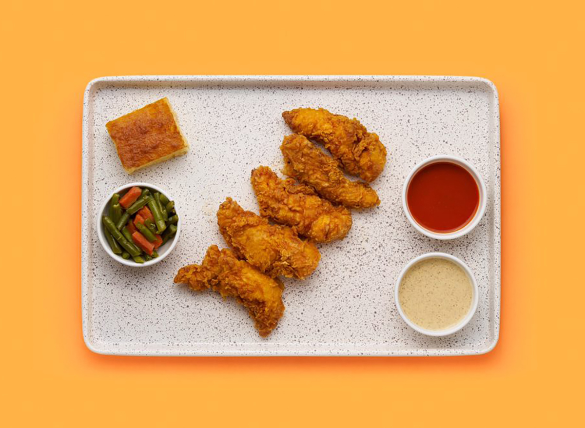 platter of chicken tenders with cornbread and green beans