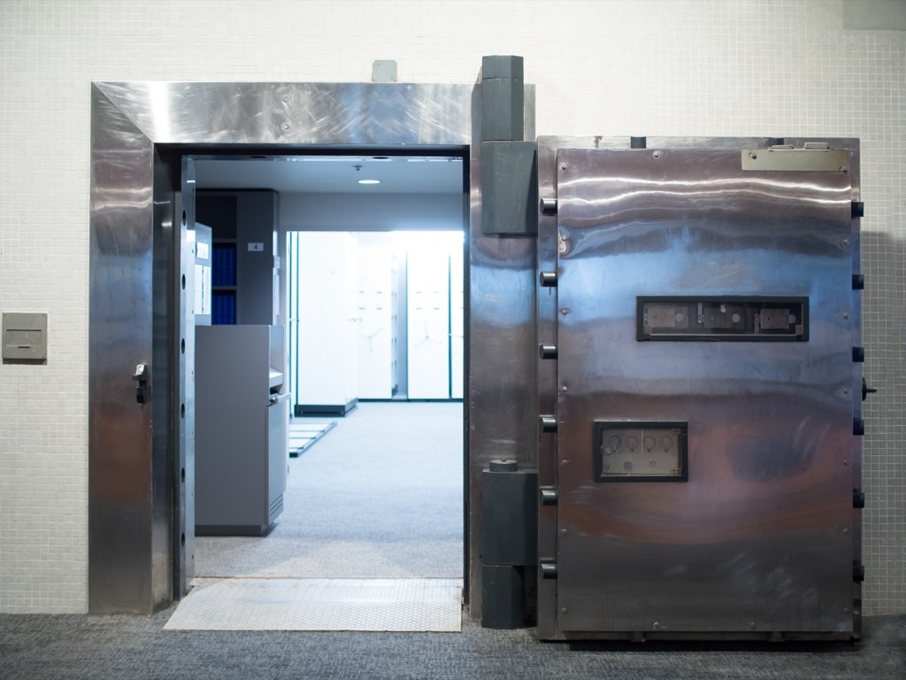 an open steel door looking into a disaster room