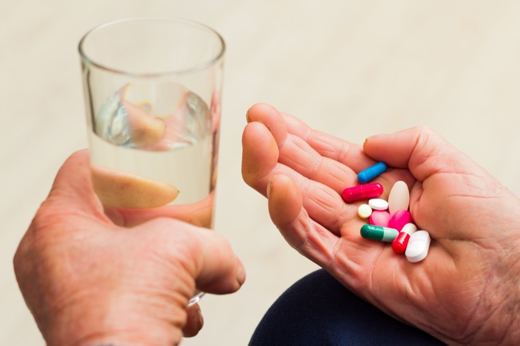 man holding pills