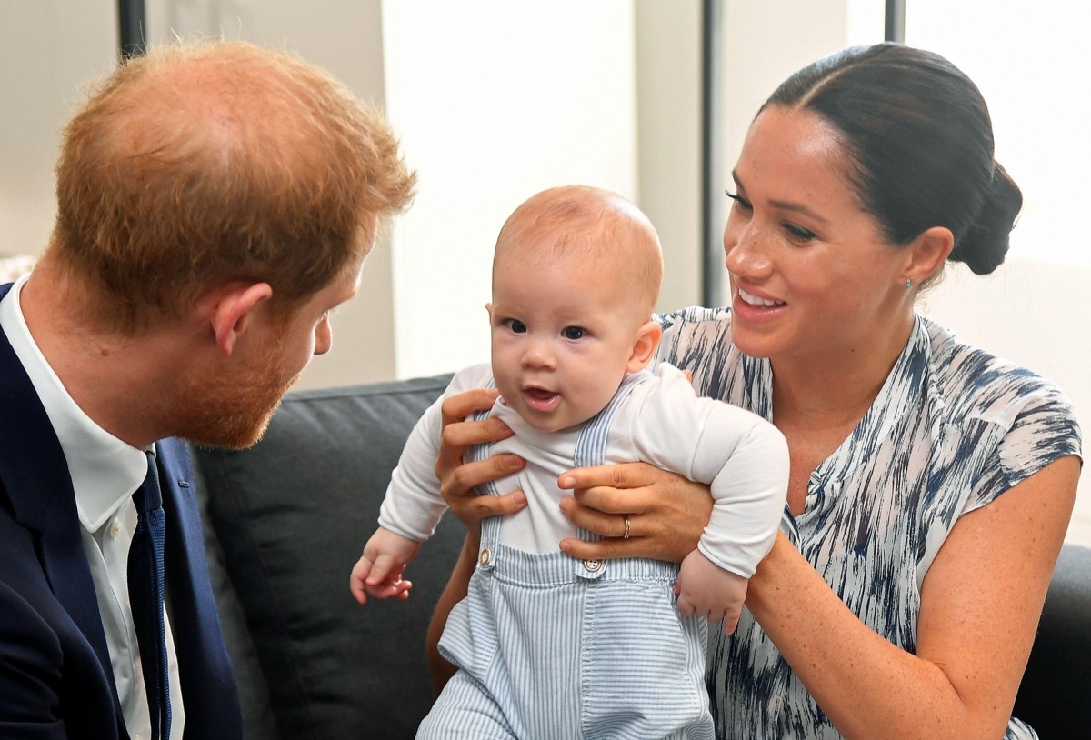 Prince Harry and Meghan Markle holding their son Archie