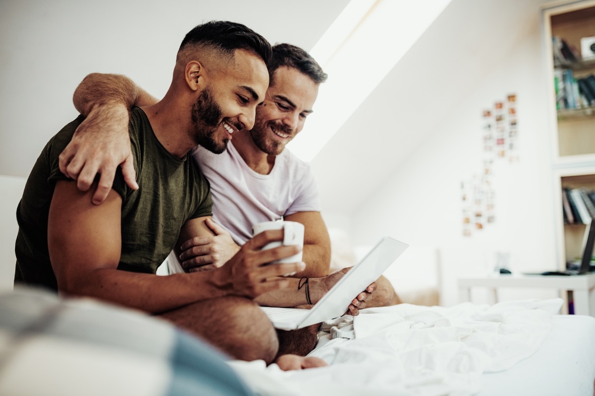 Gay couple at home in penthouse