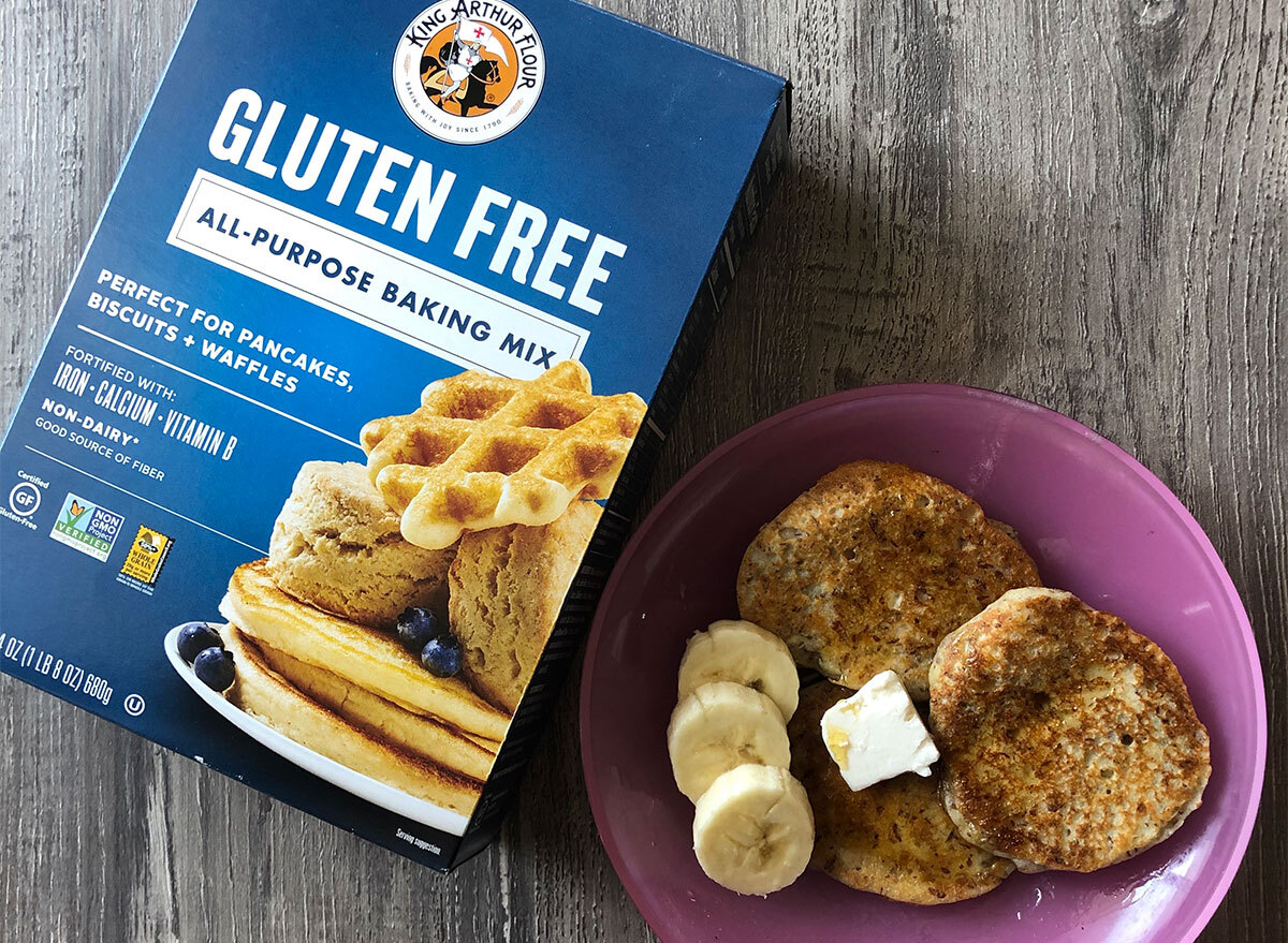 box of king arthur flour pancake mix with plate of pancakes