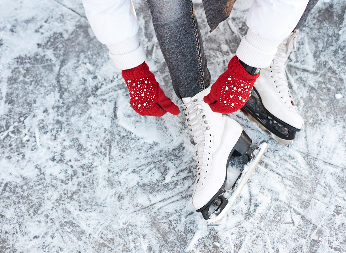 woman tying ice skates