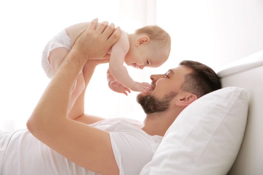 Father holding newborn baby