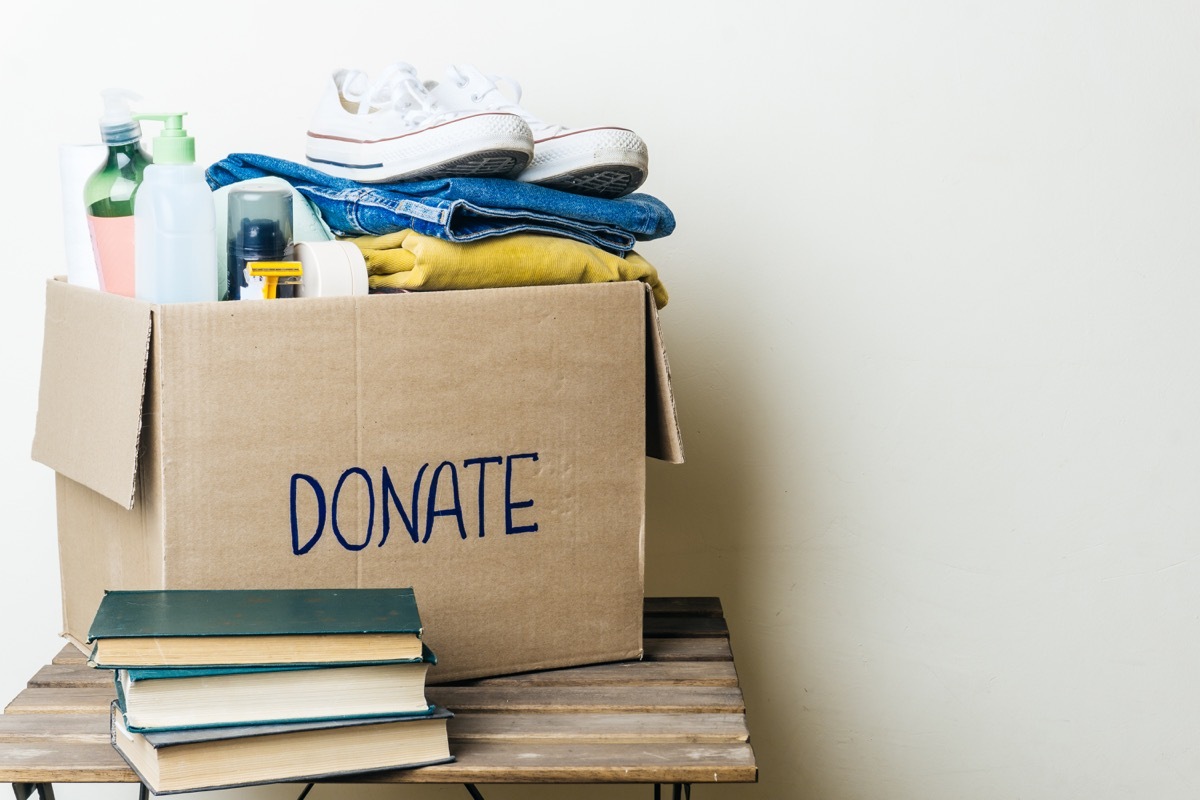 donation box with clothes and hygiene products. Copy space