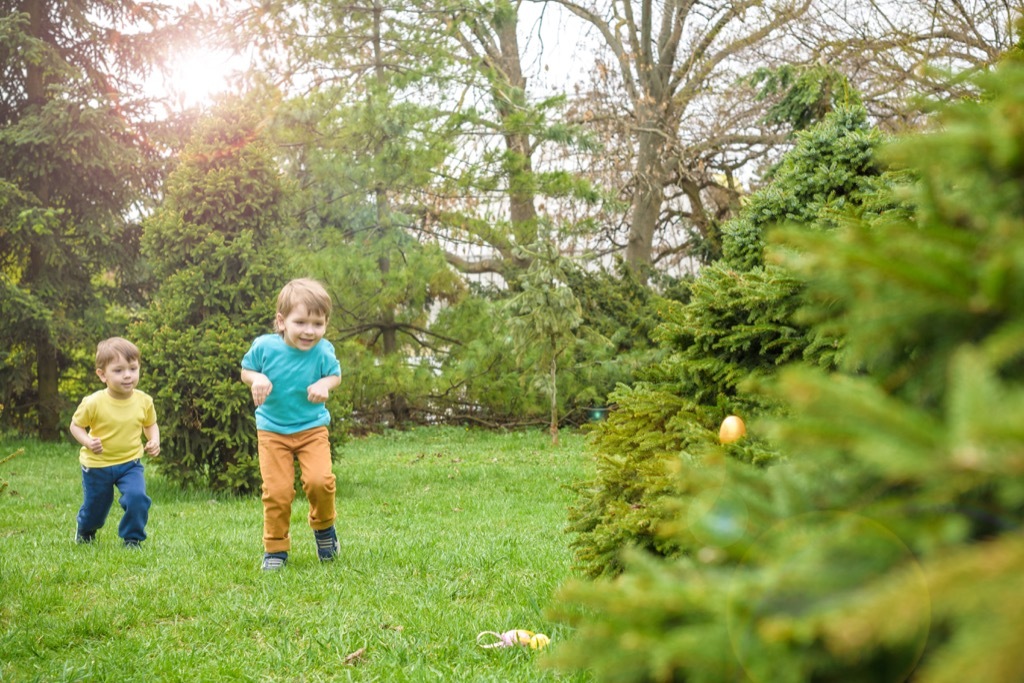 kids having an easter egg hunt outside - best easter games