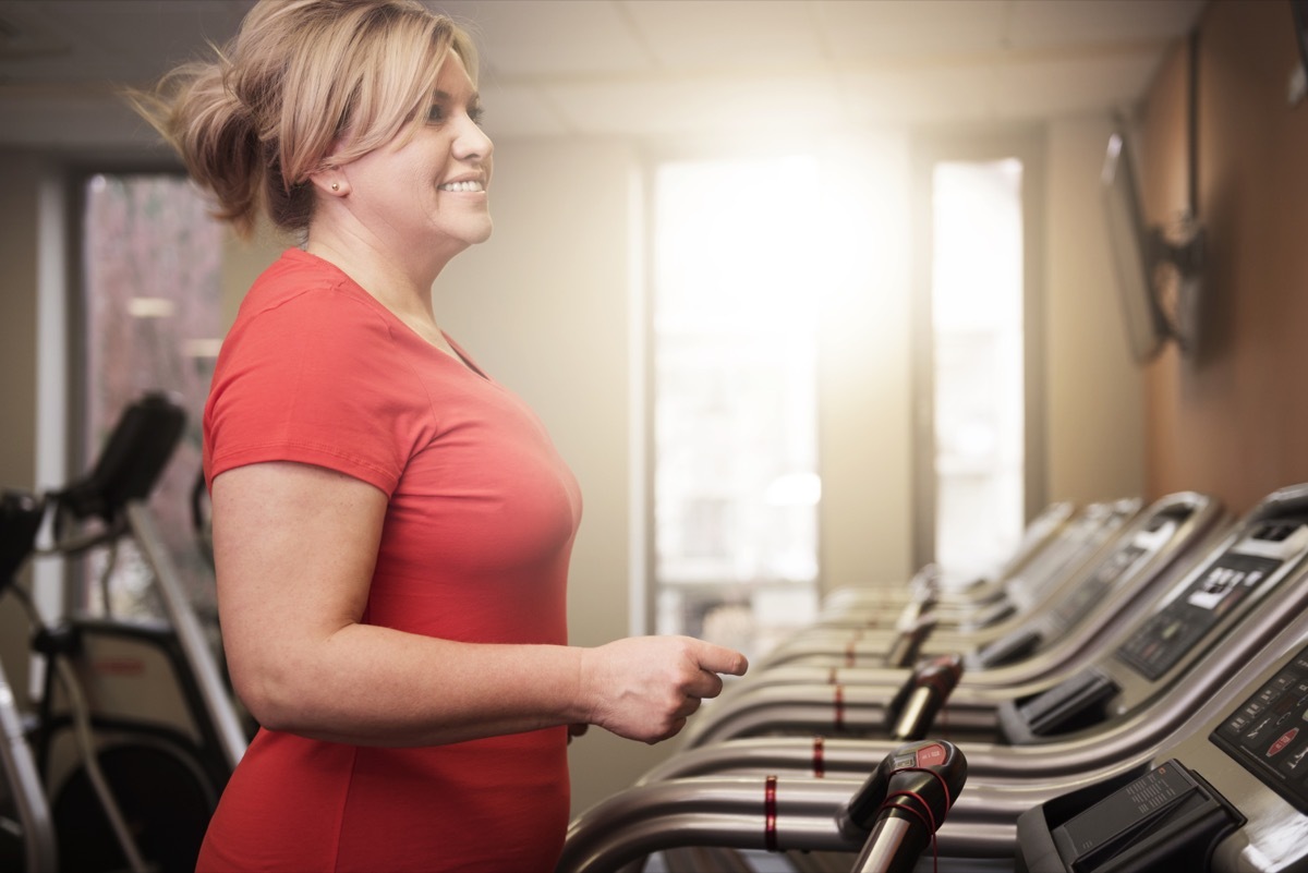 Woman Running on a Treadmill at the Gym