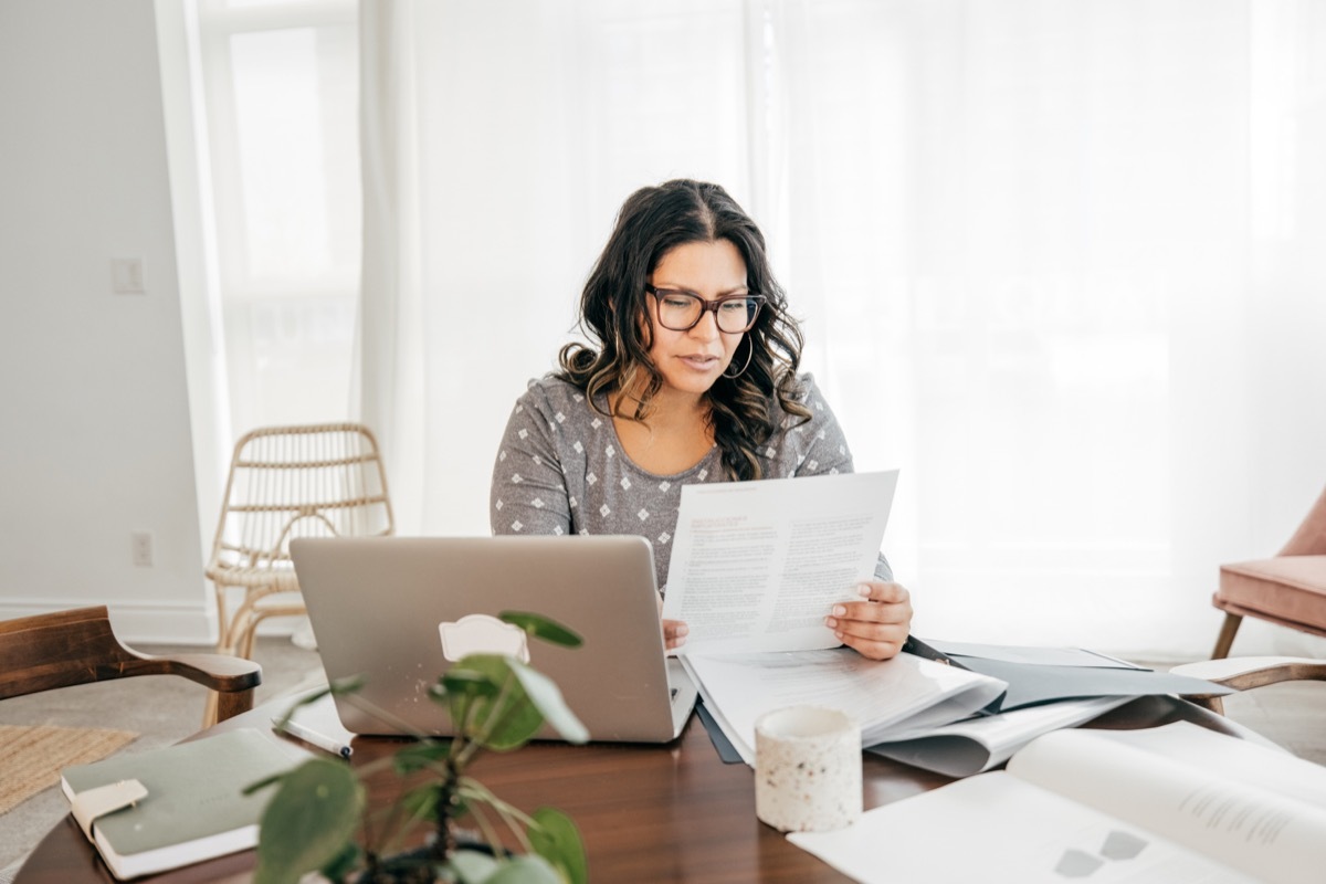 woman working from home with taxes