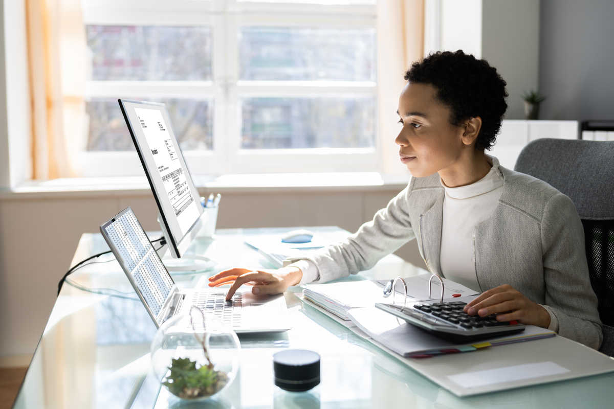 woman filing taxes at a desk