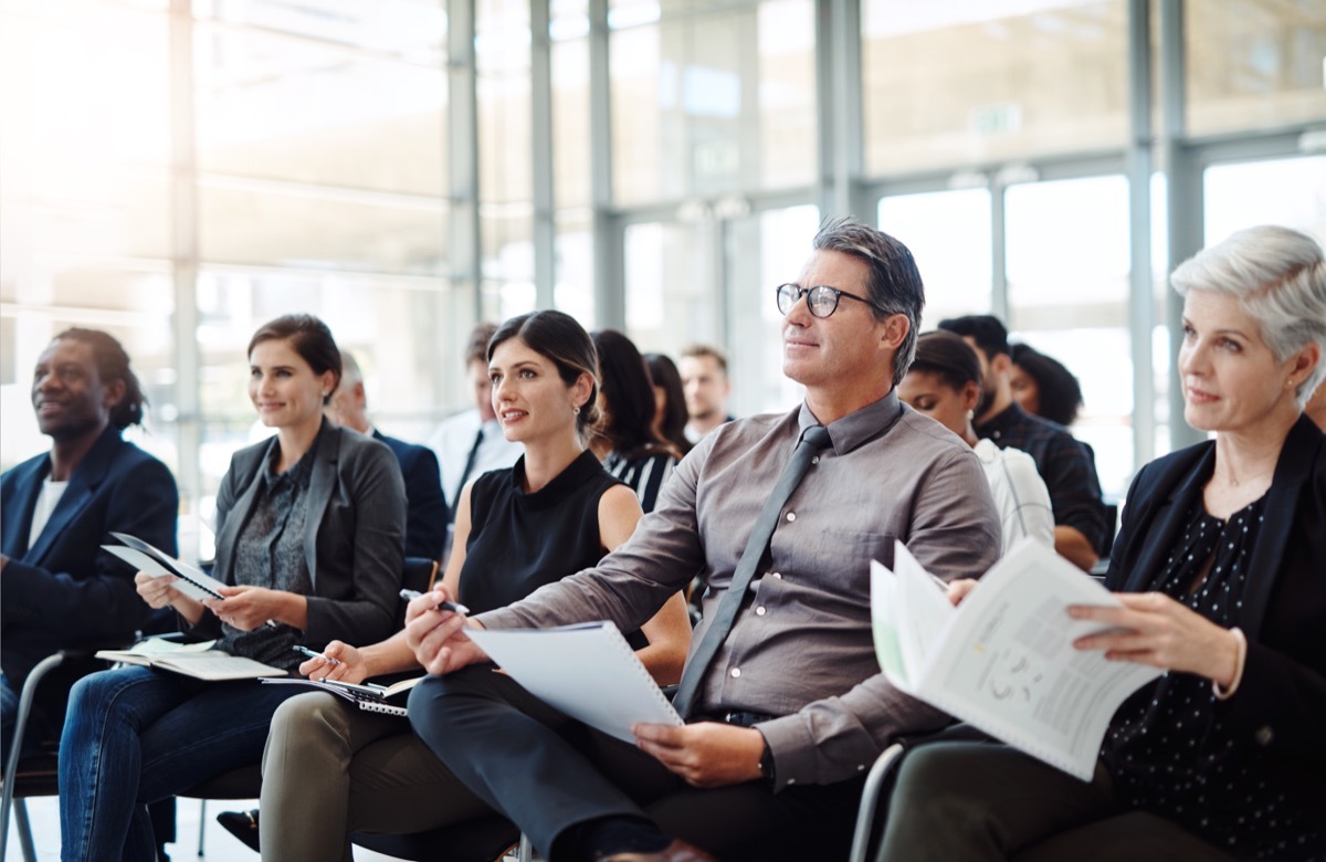 Shot of a group of businesspeople attending a conference