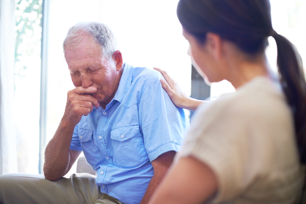 A devastated senior man dealing with some terrible news