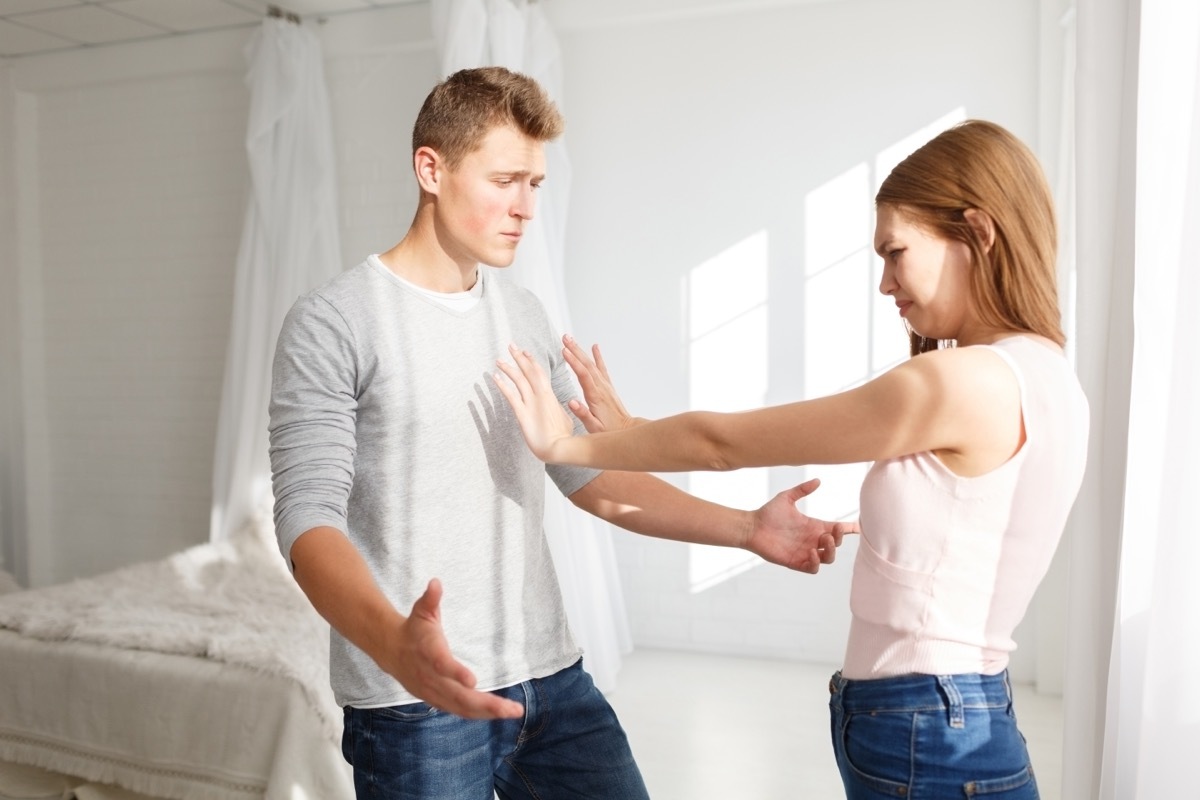 woman pushing partner away