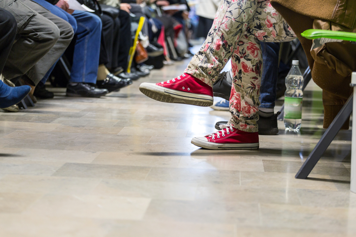 feet of people in waiting room