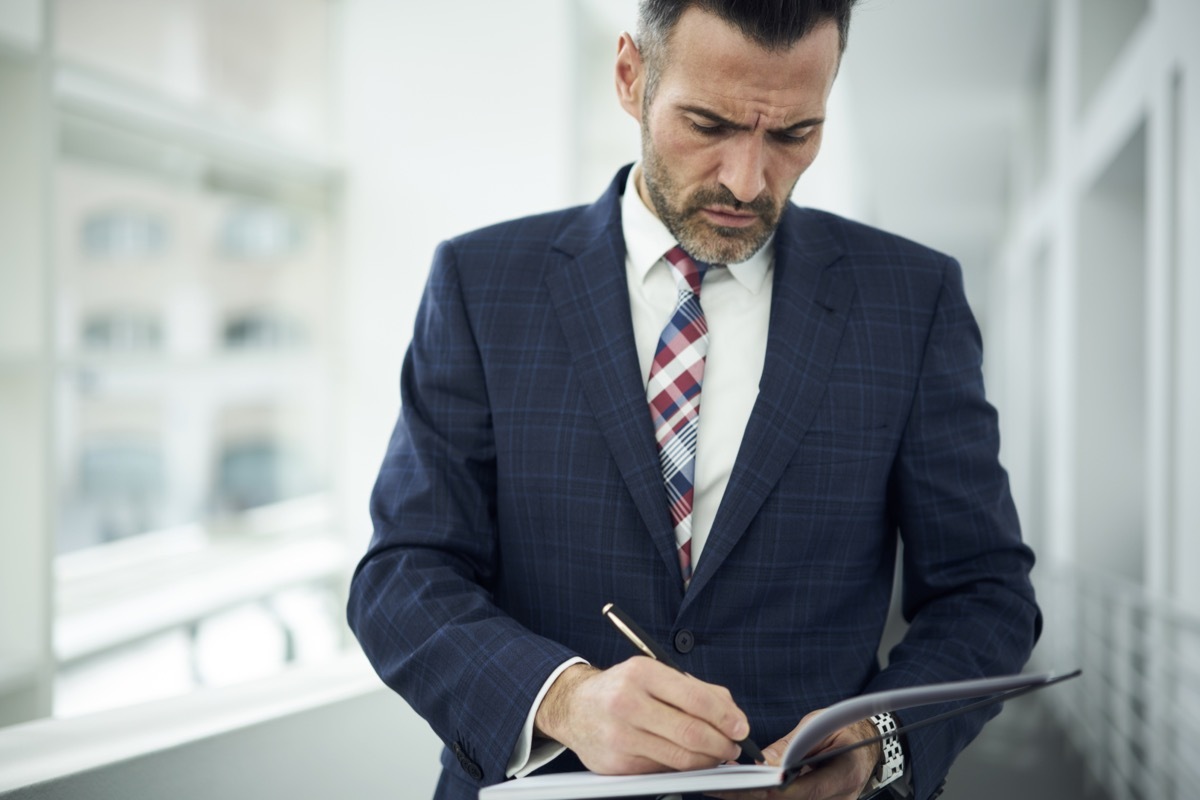 Businessman Checking Clipboard