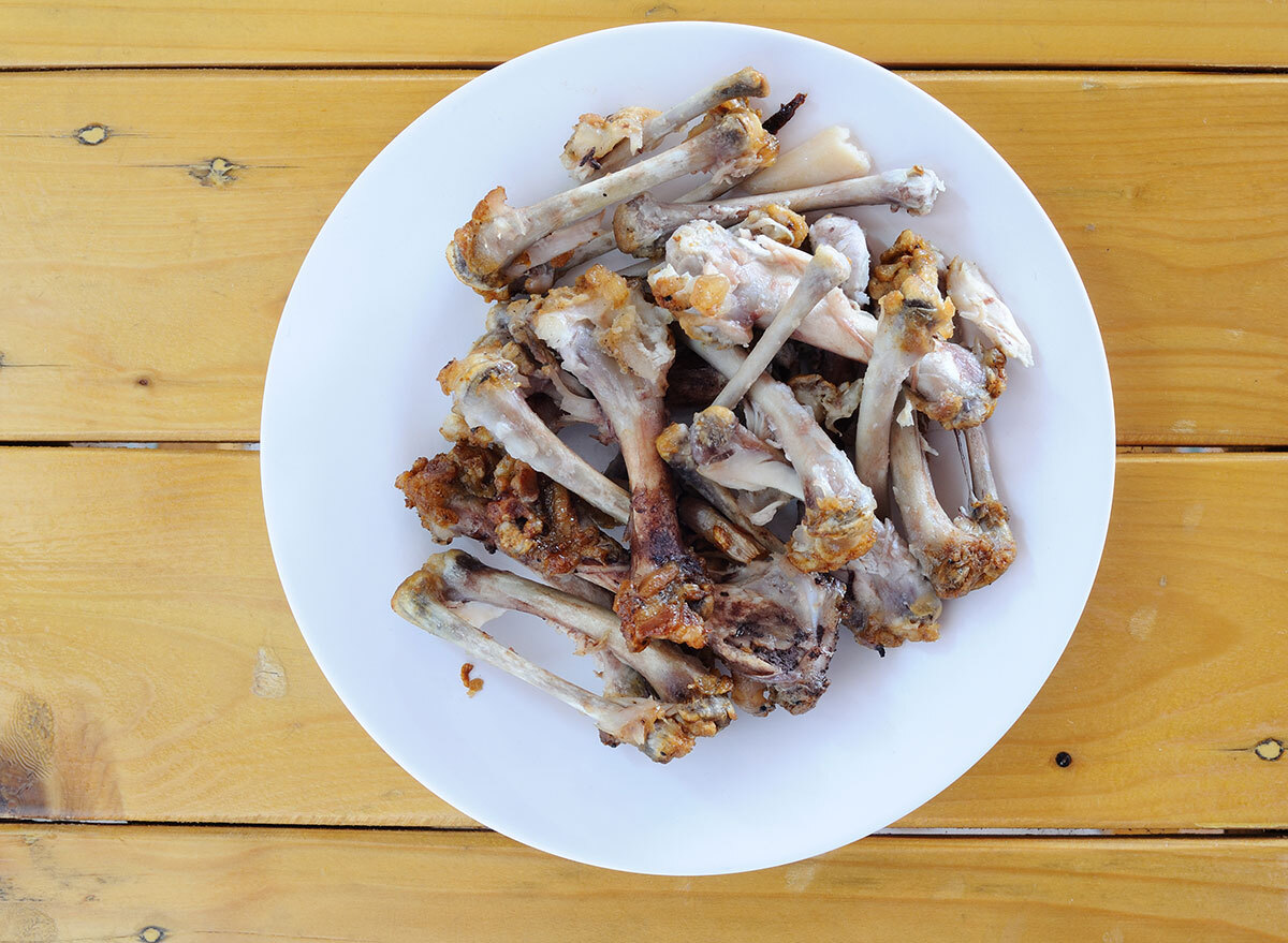 plate of cooked chicken bones