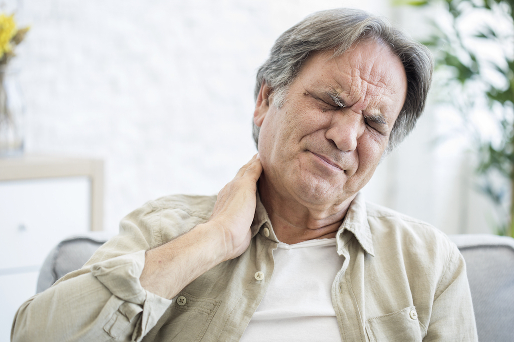 older man with neck pain