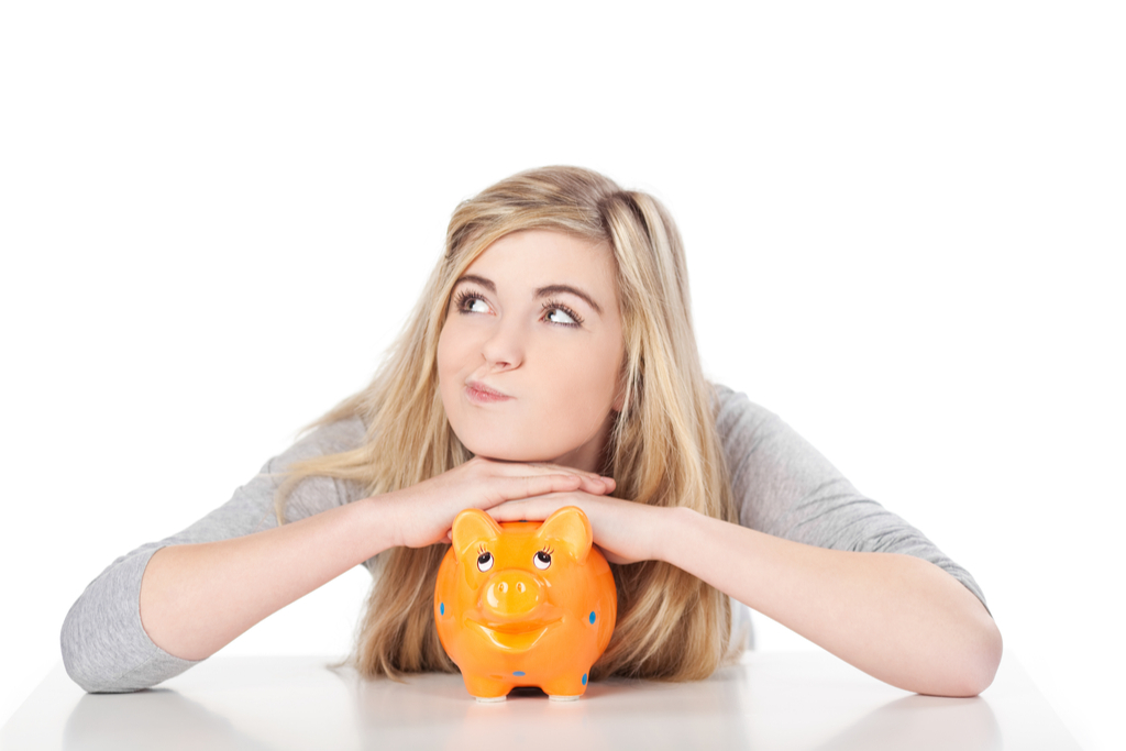 teen with piggy bank