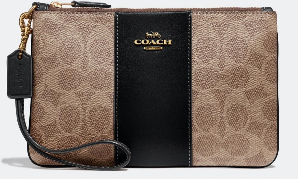 brown coach wristlet with black central band