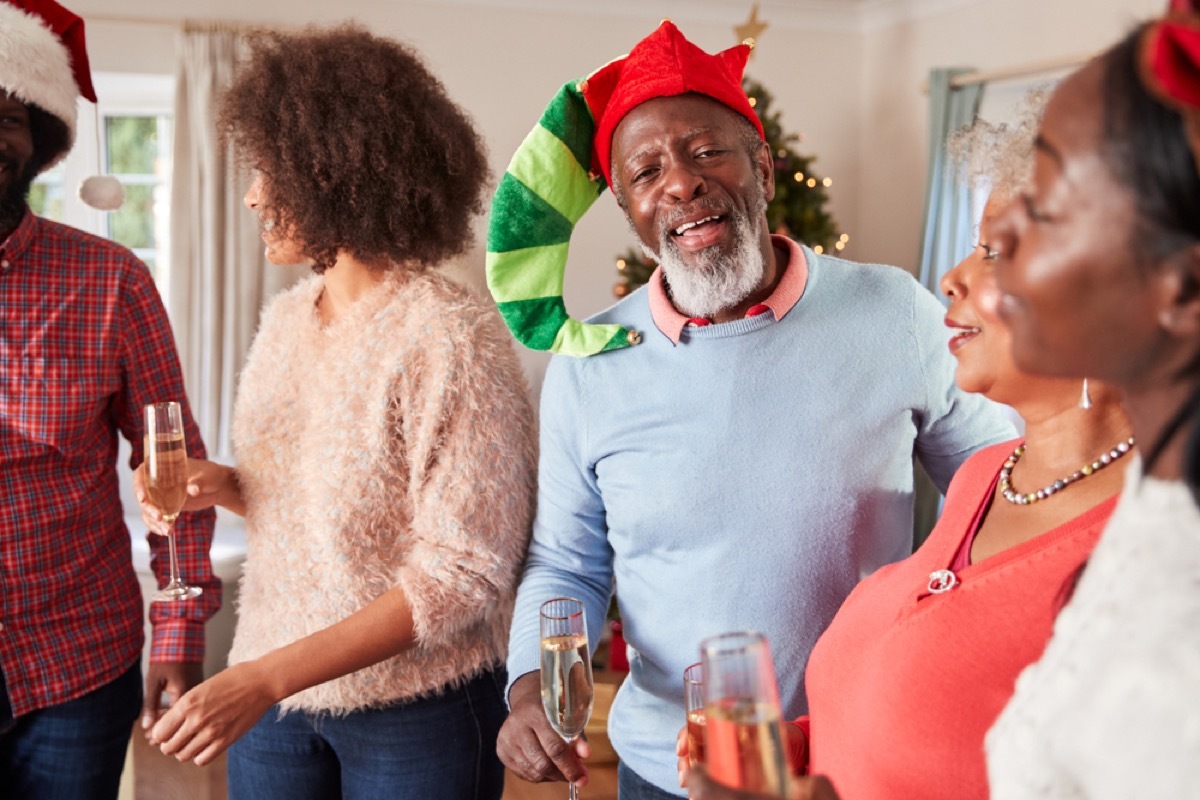 black family celebrates christmas during holiday party