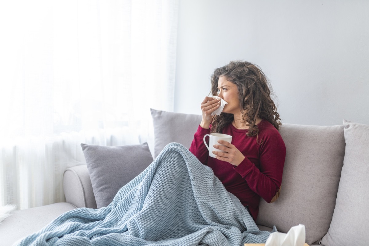 Congested woman with runny nose