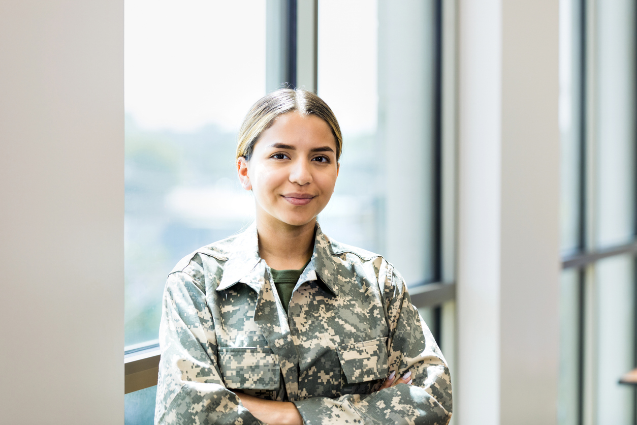 A female soldier standing in her uniform