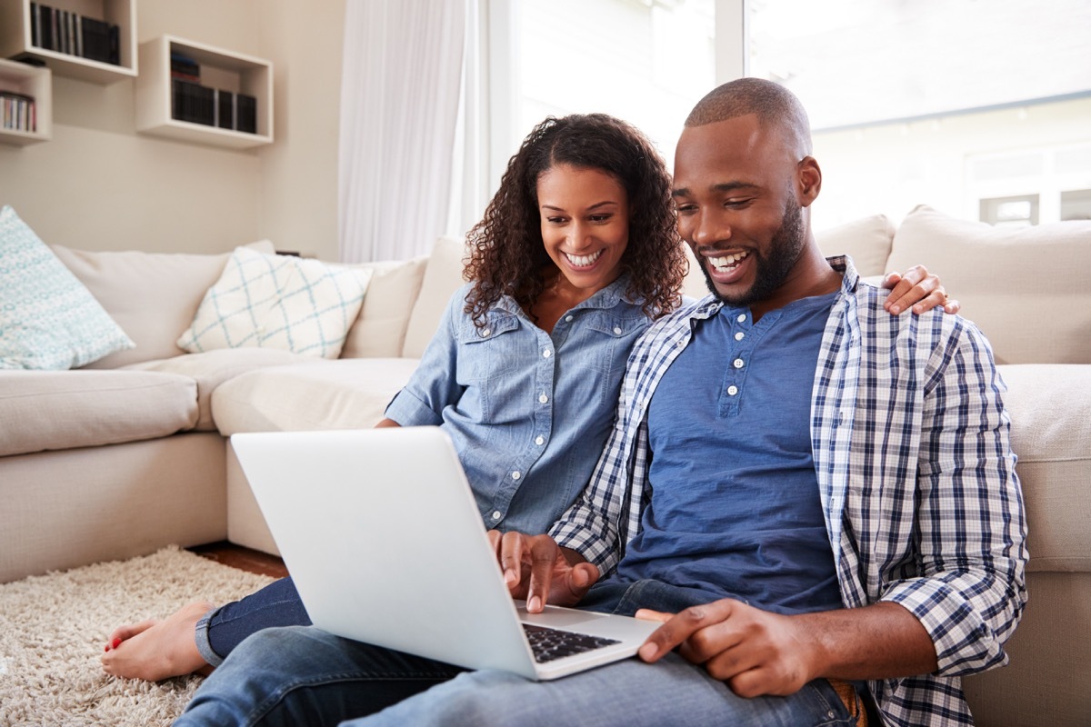 Couple looking at laptop together