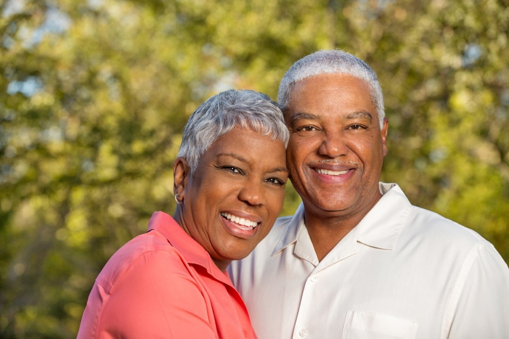 older couple smiling outside