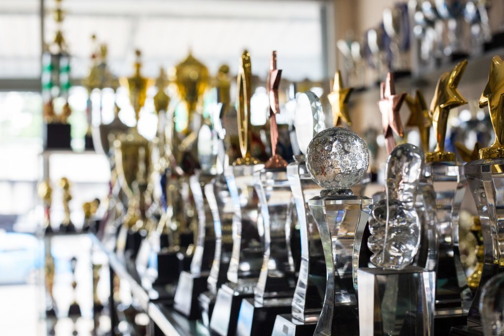 sports trophies in trophy case things to throw away